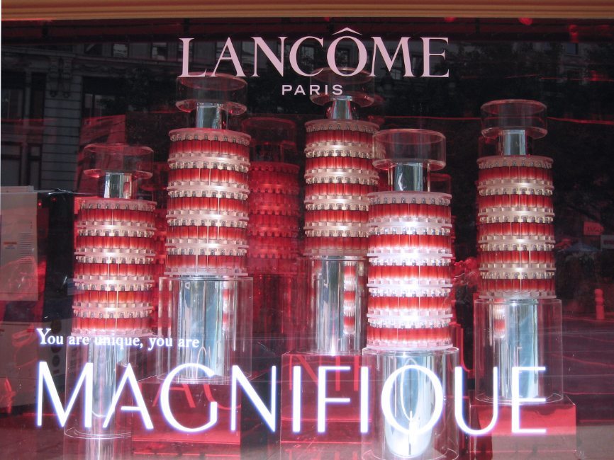 gallery image of custom retail interior project for Lancôme of Paris featuring custom lipstick holder-like cosmetic window display towers by Visual Millwork