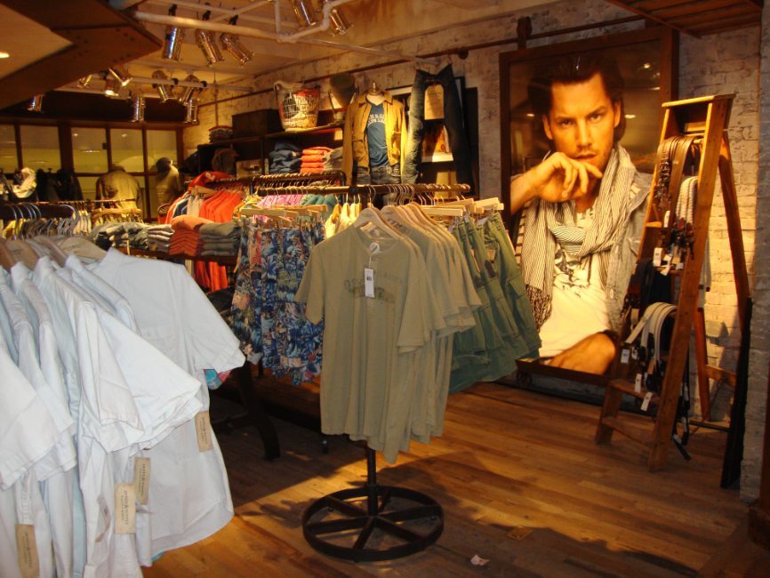 image of custom retail interior project for Ralph Lauren Denim & Supply featuring custom clothing racks by Visual Millwork