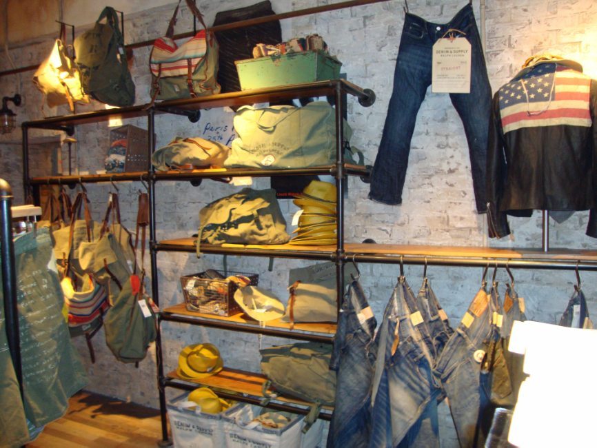 image of custom  retail interior project for Ralph Lauren Denim & Supply featuring custom wood and metal perimeter shelving by Visual Millwork