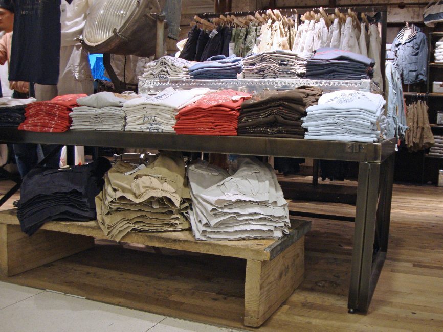 image of custom retail interior project for Ralph Lauren Denim & Supply featuring custom clothing  display tables by Visual Millwork